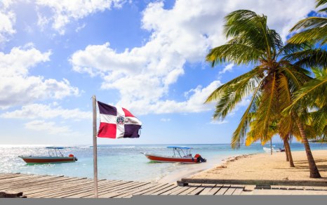 dominican-republic-flag-and-caribbean-beach